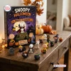 Front view of Peanuts Snoopy Halloween 2026 Advent Calendar box and figures on a table.