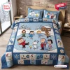 Front view of Peanuts Winter Skating Friends Bedding Set with a blue quilt and matching pillowcases featuring characters on ice.