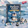 Front view of the Penguin Ocean Acrylic Advent Calendar box displayed with small penguin figurines in the snow.