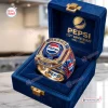 Closeup of Pepsi 133rd Anniversary 1893 - 2026 Ring inside a blue velvet box.