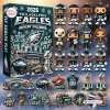 Front view of the Philadelphia Eagles 2026 Advent Calendar box alongside its included figurines and holiday ornaments.