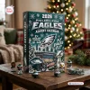 Front view of Philadelphia Eagles 2026 Advent Calendar surrounded by football figurines on a wooden table.