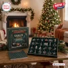 Front view of Philadelphia Eagles Christmas Advent Calendar box with 24 compartments and ornaments on a wooden table.