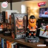 Front view of the Philadelphia Flyers Gritty vinyl figure standing beside its packaging box on a bookshelf.