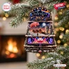 Front view of Pink Floyd 60th Anniversary Christmas Ornament hanging on a pine tree branch with a fireplace backdrop.