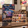 Front view of Pink Floyd Little People Collector Advent Calendar with 24 mini figures displayed on a wooden stand.