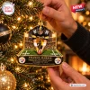 Close-up of a Pittsburgh Steelers Franco Harris Christmas ornament hanging on a lit tree.