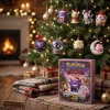 Front view of holiday advent calendar box with ghost and fairy ornaments hanging on a Christmas tree.