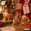 Front view of Pokemon Christmas Holiday Advent Calendar figures including Pikachu, Eevee, and Charmander in holiday attire.