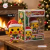 Front view of a yellow Pikachu Christmas vinyl figure standing beside its packaging box.