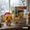 Front view of a yellow mouse vinyl figure wearing a Santa hat and holding a stocking next to its box.