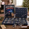 Front view of Police Vehicles Christmas Advent Calendar with 24 numbered doors and acrylic ornaments on table.