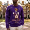 Front view of a purple sweatshirt featuring a bear graphic and Omega Psi Phi text.