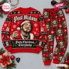 Flat lay of red Post Malone Christmas sweater and jogger pants set with holiday motifs.