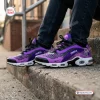 Lifestyle view of Prince Purple Air Max Plus Sport Shoes worn with dark jeans.