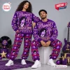 Front view of two models wearing the Prince Purple Ugly Christmas Sweater Jogger Set in a purple holiday scene.