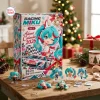 Front view of Racing Miku Advent Calendar 2026 box with miniature figures arranged on a wooden table.
