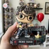 Close-up of Richie Tozier Funko Pop Figure standing on a diorama base with a red balloon and storm drain.
