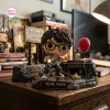 Front view of Richie Tozier Funko Pop Figure holding flashlight on detailed Derry Maine diorama base.