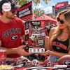 Man and woman holding Riddell Georgia Bulldogs Mini Helmet Advent Calendar.