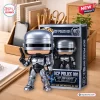 Front view of the Robocop OCP Police 001 40th Anniversary Figure standing beside its packaging box on a wooden desk.
