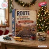 Front view of Route 66 100 Years Advent Calendar box with miniature toy vehicles on a wooden table.