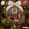 Front view of a Route 66 100th Anniversary Christmas Ornament featuring a miniature red car, gas pump, and motel on a tree.