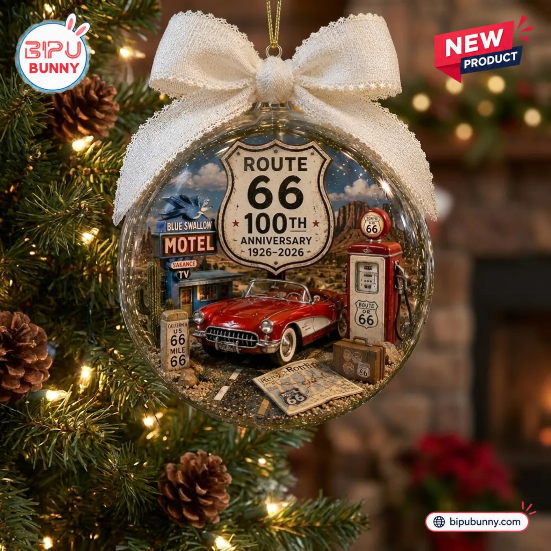 Front view of a Route 66 100th Anniversary Christmas Ornament featuring a miniature red car, gas pump, and motel on a tree.