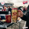 Close-up of a person holding a gold San Francisco 49ers 80th Anniversary Tumbler Cup with a red handle and lid.