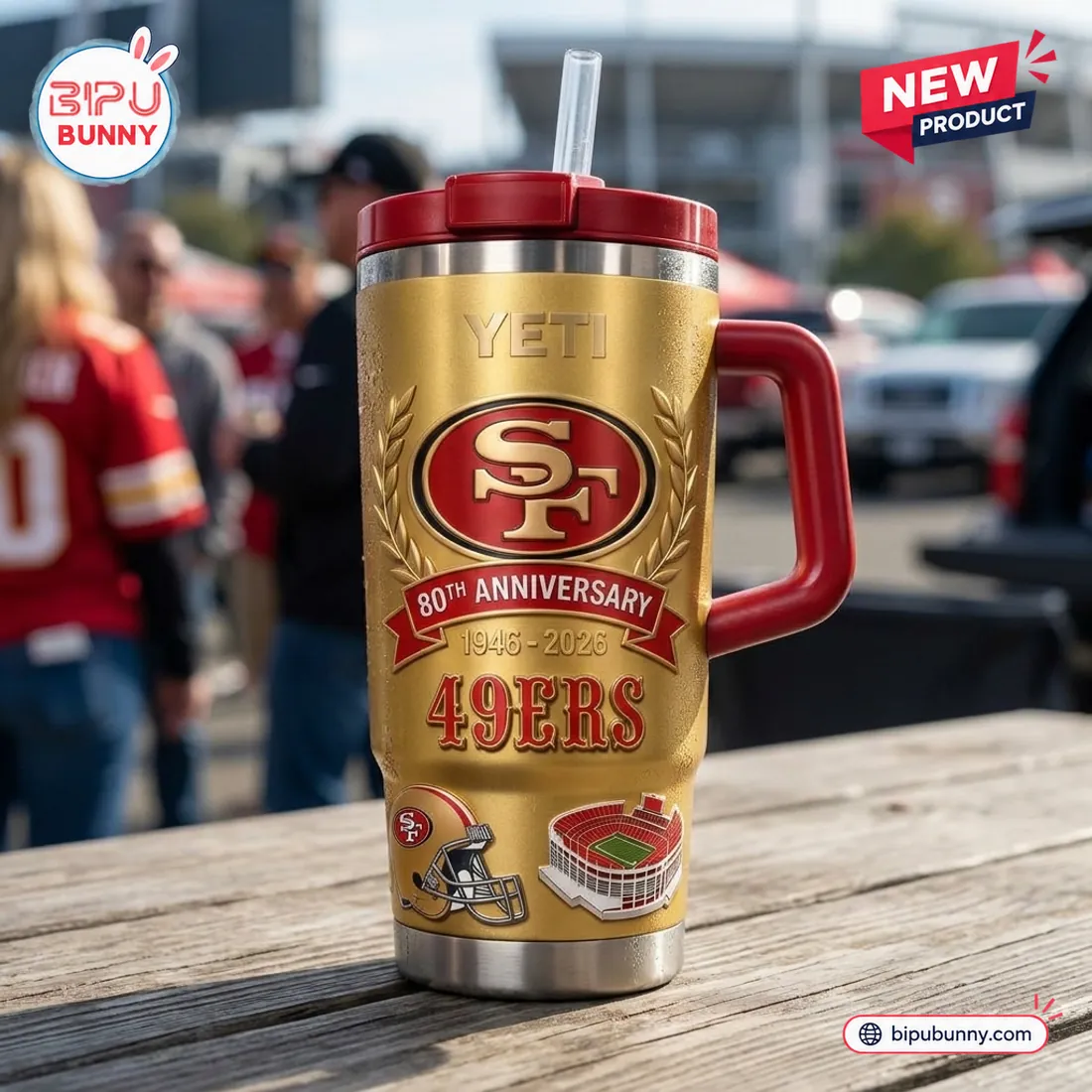 Outdoor stadium view of the San Francisco 49ers 80th Anniversary Tumbler Cup displaying the gold finish, laurel-wreathed SF logo, 1946-2026 banner, helmet, and stadium art