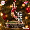 Hanging San Francisco 49ers Dwight Clark Christmas Ornament depicting The Catch play over a stadium base.