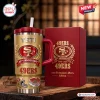 Front view of the San Francisco 49ers Gold 80th Anniversary Tumbler with a matching red box.