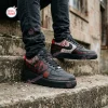 Lifestyle view of Saw Horror Movie Spiral Air Force 1 Sneakers worn outdoors on concrete steps.