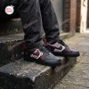 Lifestyle view of Saw Horror Movie Spiral Air Force 1 Sneakers worn outdoors on stone steps.