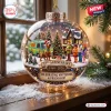 Front view of a clear holiday sphere ornament featuring a group of characters, a van, and a banner reading 57th Anniversary.