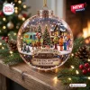 Front view of a clear holiday ornament featuring characters, a mystery van, and a banner reading 57th Anniversary.
