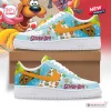 Side view of Scooby-Doo Blue Air Force Low-Top Sneakers featuring cartoon graphics and orange swooshes.