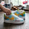 Side view of Scooby-Doo Blue Air Force Low-Top Sneakers featuring cartoon character print and yellow swoosh on a wooden table.