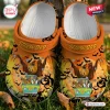Top view of Scooby Doo Halloween Crocs clogs shoes featuring a spooky van and pumpkin pattern.