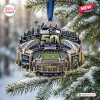 Front view of a Seattle Seahawks 50th Anniversary Christmas Ornament hanging on a snowy pine tree branch.