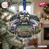 Close-up of a Seattle Seahawks 50th Anniversary Christmas Ornament hanging on a pine tree branch.