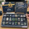 Front view of a football team Christmas advent calendar with open grid tray displaying twenty four sports themed ornaments.