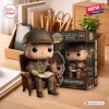 Front view of Sherlock Holmes 140th Anniversary Collectible Figure sitting in an armchair with a book.