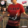 Front view of the Slash Flying Blind World Tour 2027 red shirt worn outdoors near a metal barrier.