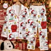 Front view of a white Snoopy Christmas pajamas set featuring a holiday dog print.