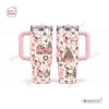 Front and back view of a Snoopy Christmas Pink 40Oz Tumbler featuring festive illustrations and a pink handle.