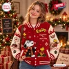 Front view of Snoopy Happiness Is A Warm Hug Varsity Jacket worn near a Christmas tree.