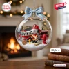Front view of Snoopy Happy Holidays Snow Globe Ornament featuring a firefighter theme.
