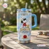 Front view of the Snoopy Joe Cool Handle Tumbler on an outdoor wooden table.