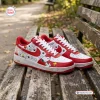 Side view of Snoopy Peanuts Custom Air Force 1 Sneakers in red and white resting on a park bench.